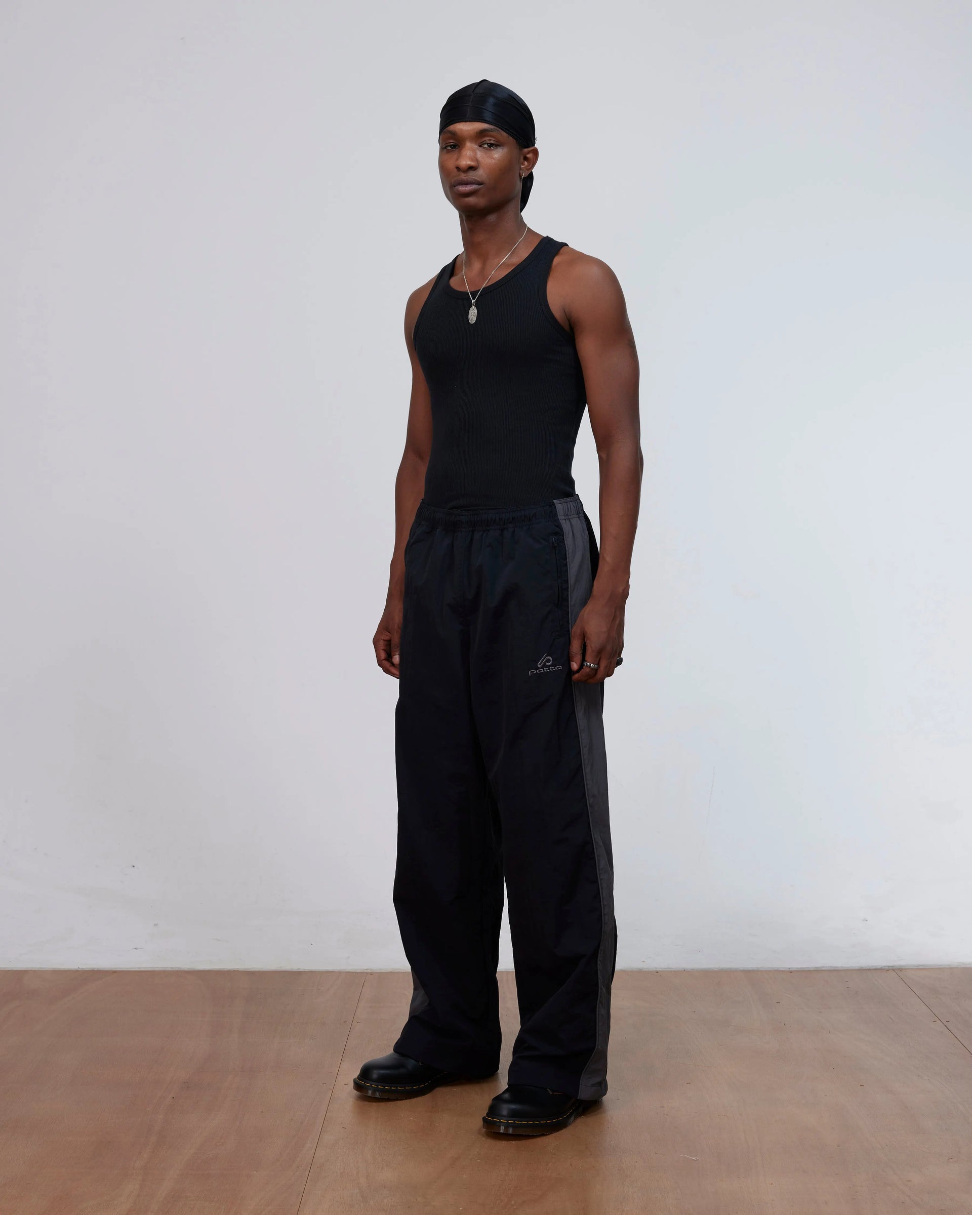 Patta Panelled Oversized Track Pants (Black) Patta